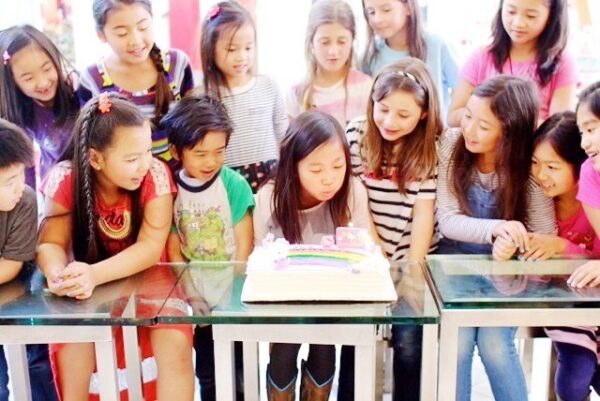 group photo, blowing out candles