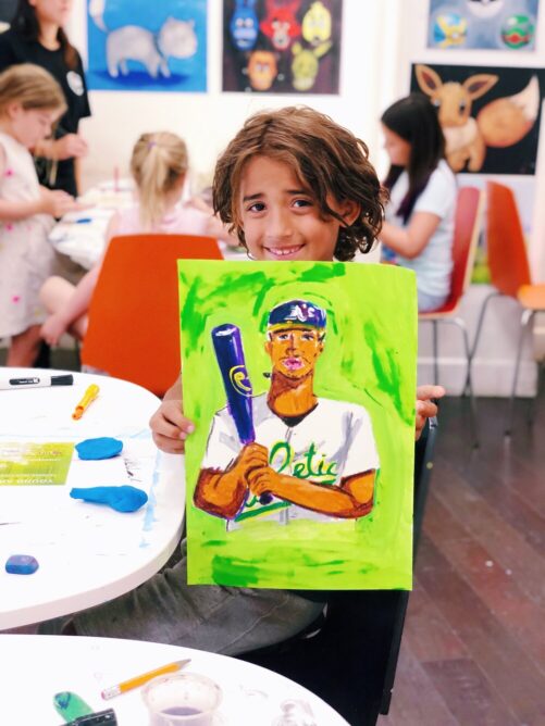 young artist with baseball player painting