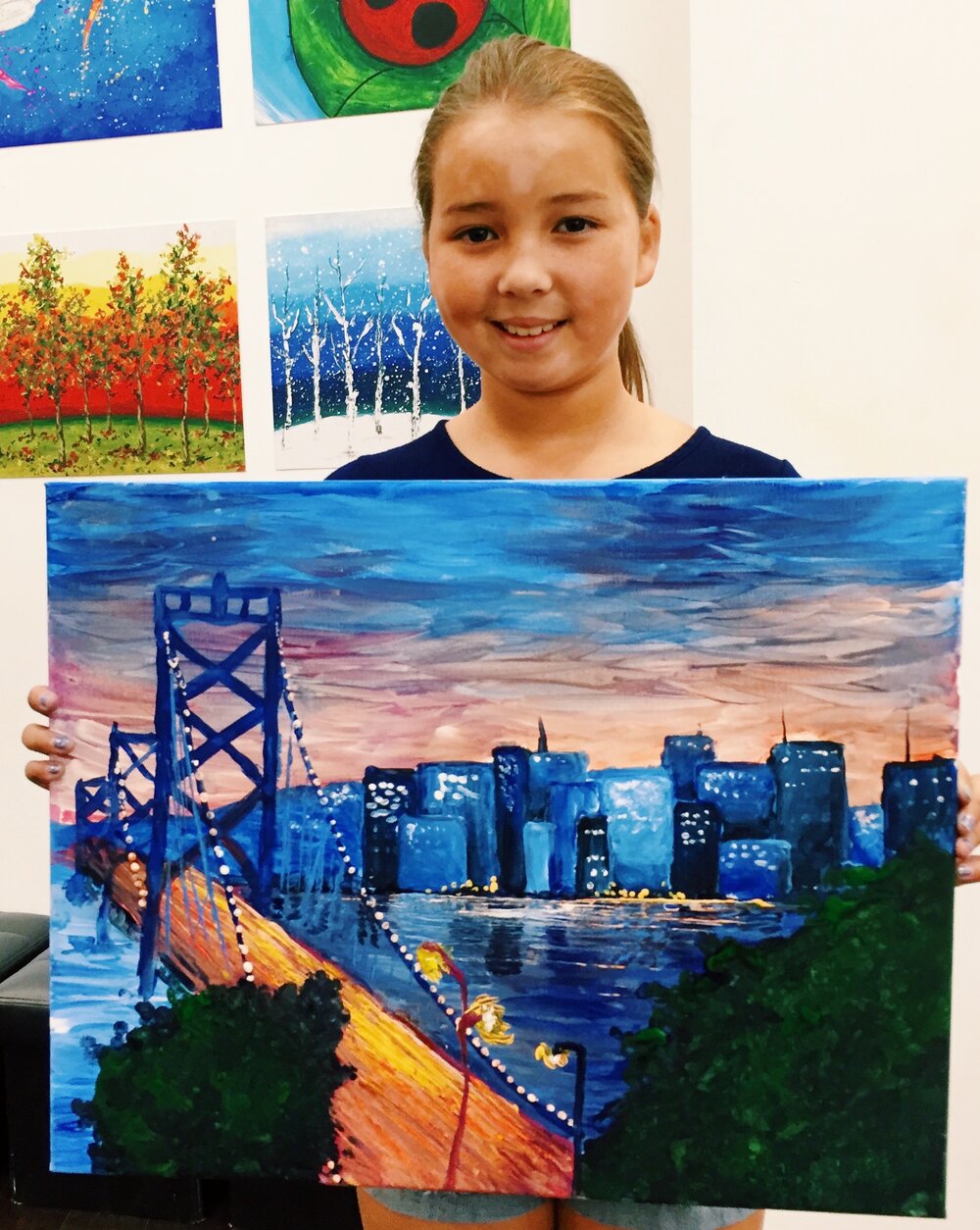 young artist with the bay bridge and city in background