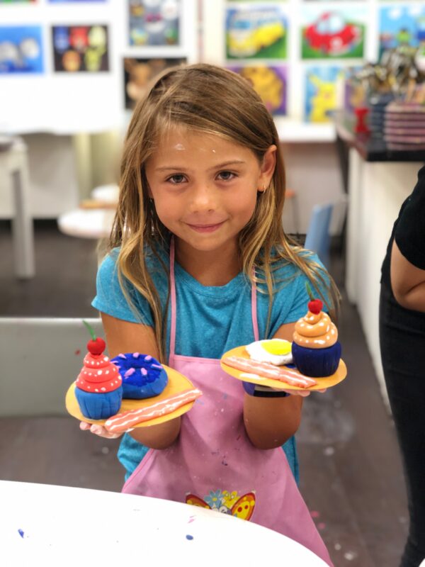 art student with clay food