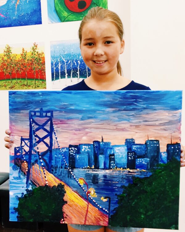 art student with painting with bay bridge artwork