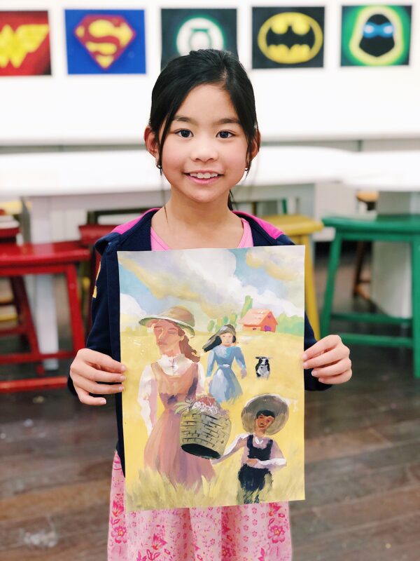 girl holding watercolored painting