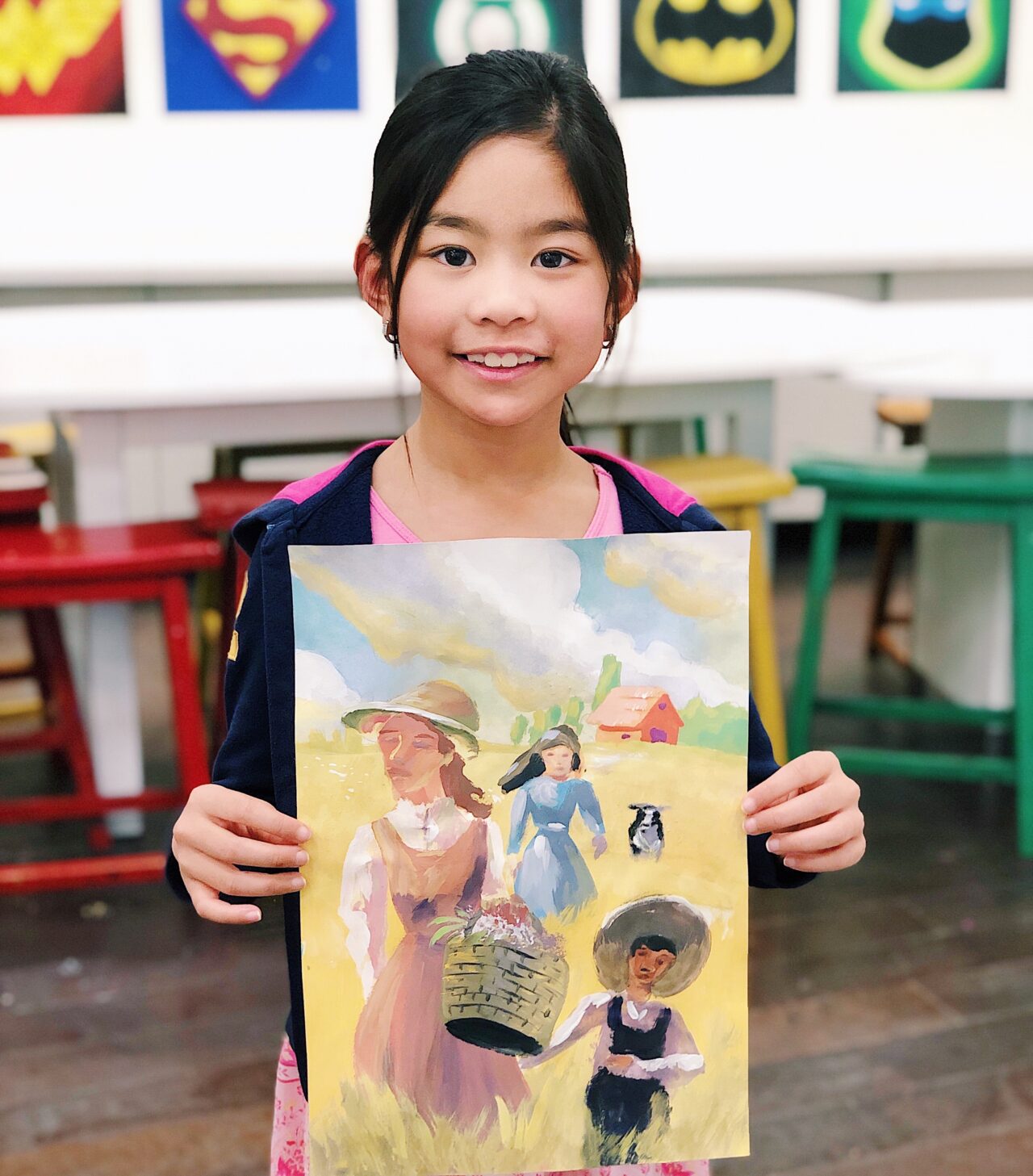 art student holding watercolor painted image