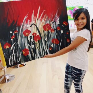 image of student holding artwork of flowers