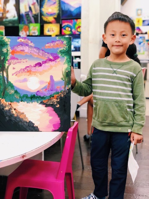 student showing scenery art