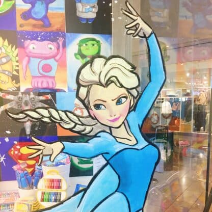 image of elsa using her ice powers drawn on glass