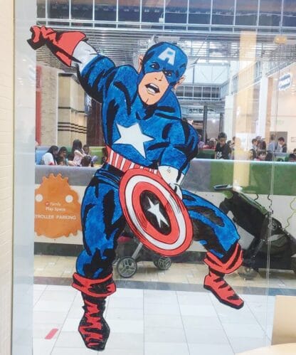 image of captain america leaping with shield drawn on glass