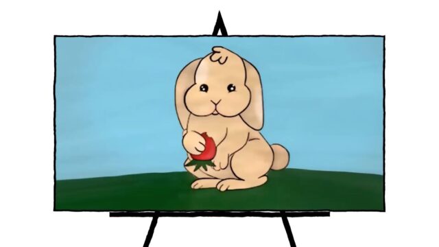 beige bunny holding strawberry on green grass with blue background