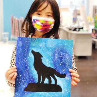 student holding painting of wolf