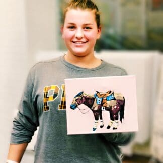 girl holding painting of a horse