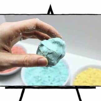 hand holding blue colored sand