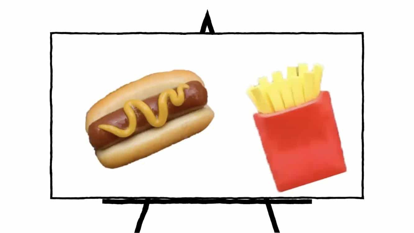 image of clay sculpted hot dog with bun and mustard and fries in red container