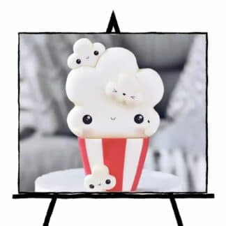 image of 3d sculpture of popcorn and container with red and white stripes and happy