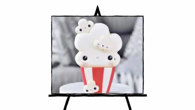 image of 3d sculpture of popcorn and container with red and white stripes and happy