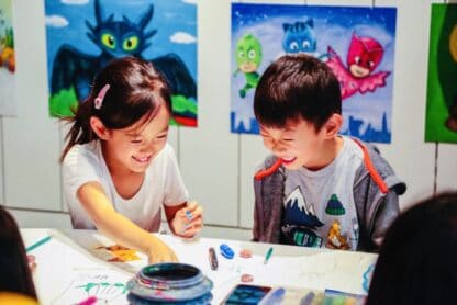 image of two students having fun in the studio