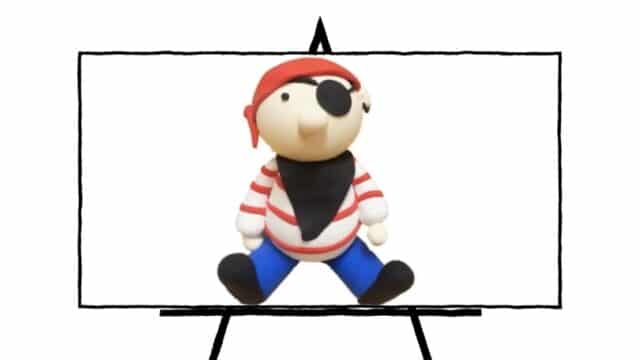 image of 3d sculpted clay pirate with blue pants, striped red and white shirt, black bandana and black eyepatch with red head scarf
