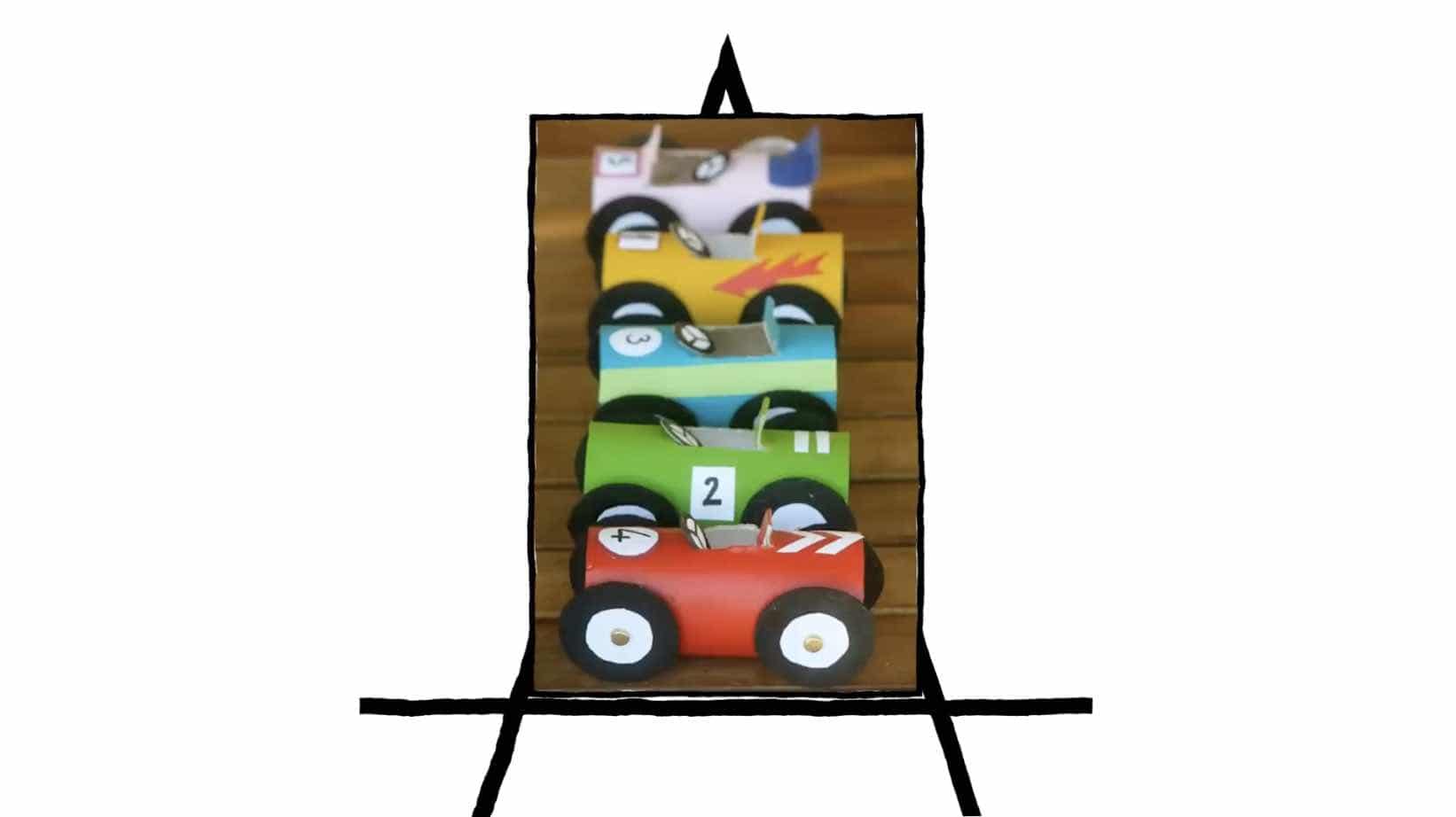 image of five race cars made of paper in various colors