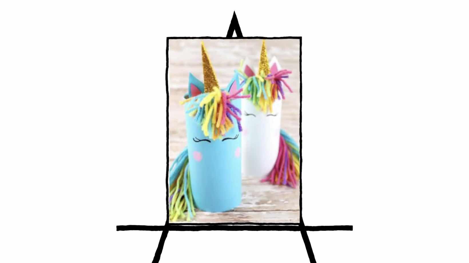 image of two unicorns made of paper tubes with colorful hair and yellow horn