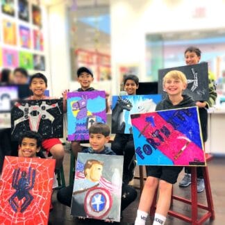 image of birthday guests holding canvas paintings