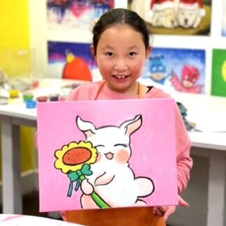 girl holding canvas painting of white bunny with sunflower