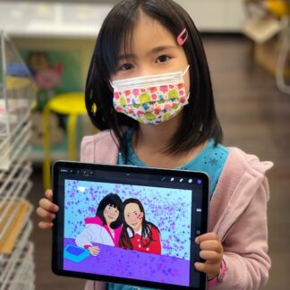 image of a girl holding an iPad showing her digitally drawn art