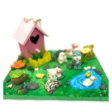 image of a canvas decorated to make a spring scene with clay creatures