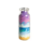 image of a bottle of colorful sand as art