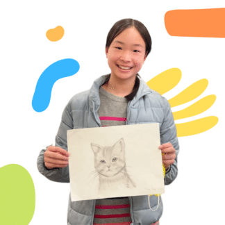 image of a girl holding her pencil sketch of a cat