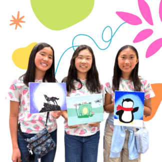 Image of 3 girls holding their canvas paintings and smiling in color