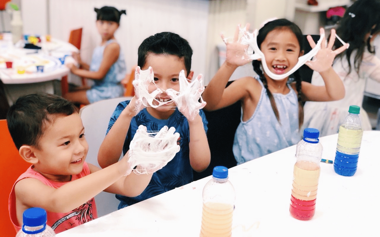 picture of 3 kids holding slime