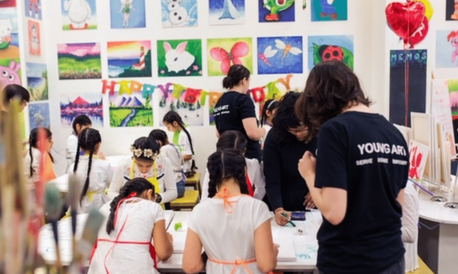 students visiting young art studio for class trip