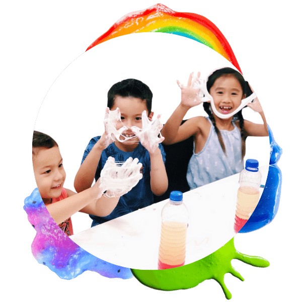 image of three kids playing with slime and smiling