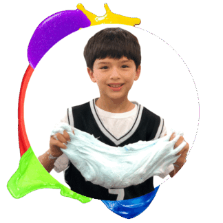 image of a young boy holding slime and smiling