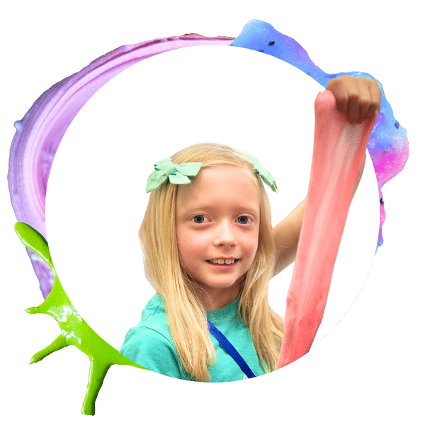 image of a young girl smiling and stretching pink slime